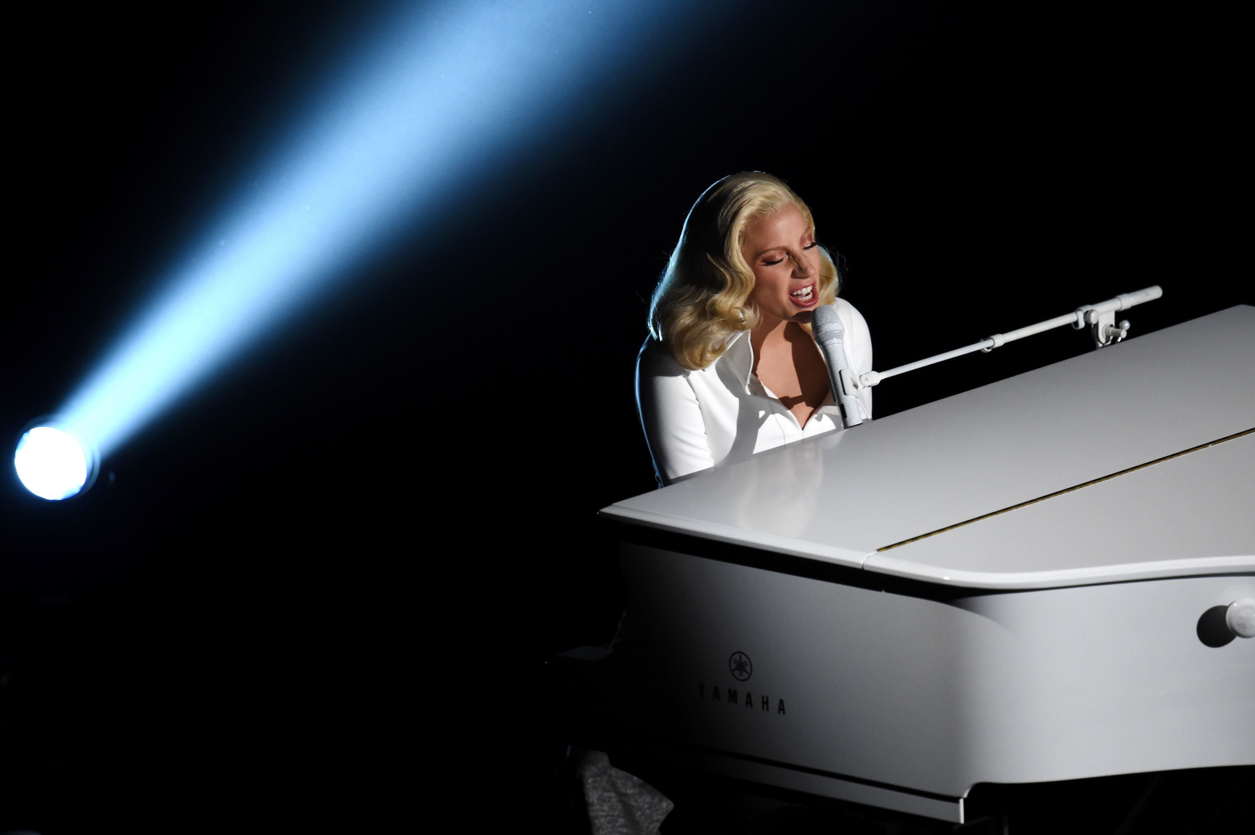 HOLLYWOOD, CA - FEBRUARY 28: Singer-songwriter Lady Gaga performs onstage during the 88th Annual Academy Awards at the Dolby Theatre on February 28, 2016 in Hollywood, California. Kevin Winter/Getty Images/AFP / AFP / GETTY IMAGES NORTH AMERICA / KEVIN WINTER