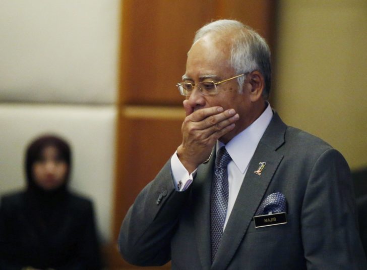 File photo of Malaysia's Prime Minister Najib Razak arriving at a presentation for government interns at the Prime Minster's office in Putrajaya