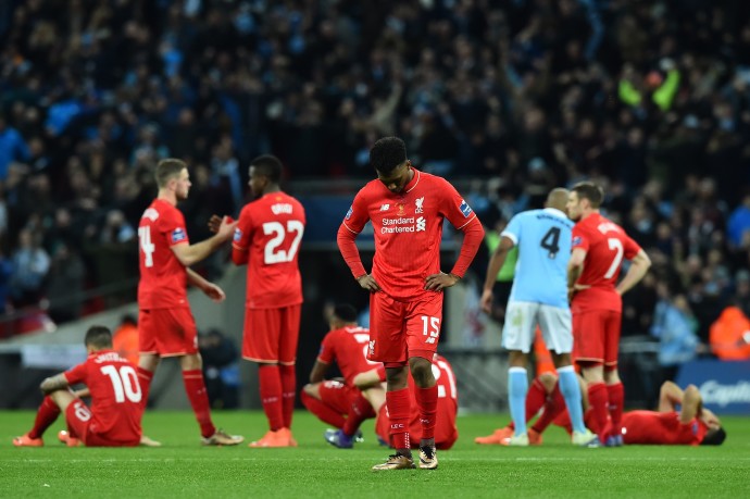 Liverpool's English striker Daniel Sturridge (C) reacts after Manchester City won the penalty shoot-out to win the English League Cup final football match between Liverpool and Manchester City at Wembley Stadium in London on February 28, 2016. / AFP / BEN STANSALL / RESTRICTED TO EDITORIAL USE. No use with unauthorized audio, video, data, fixture lists, club/league logos or 'live' services. Online in-match use limited to 75 images, no video emulation. No use in betting, games or single club/league/player publications. /
