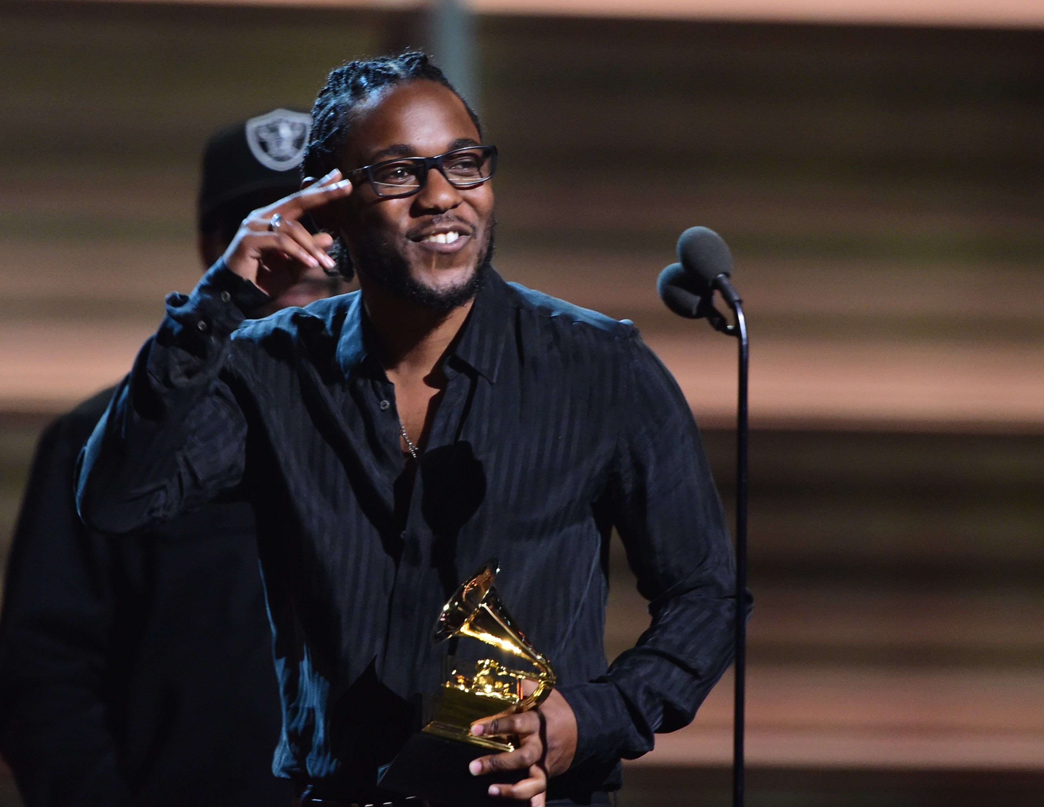 Recording artist Kendrick Lamar recieves the award for the Best Rap Album, To Pimp A Butterfly during the 58th Annual Grammy music Awards in Los Angeles February 15, 2016. AFP PHOTO/ ROBYN BECK / AFP / ROBYN BECK