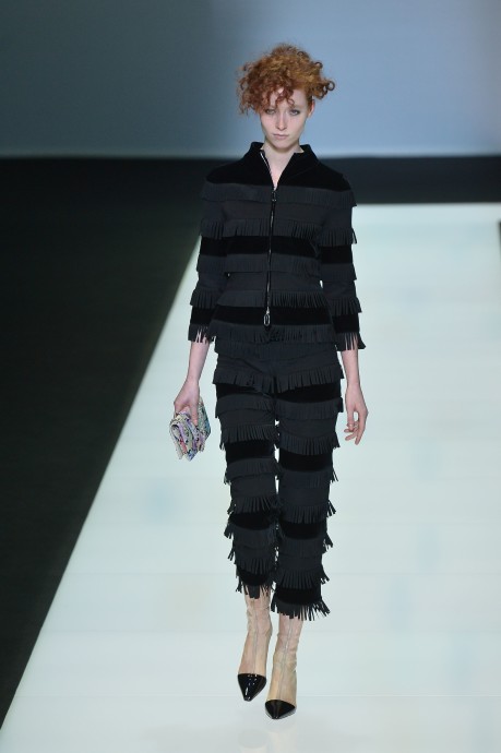 A model presents a creation for fashion house Giorgio Armani as part of the Women Autumn / Winter 2016 Milan Fashion Week on February 29, 2016. AFP PHOTO / TIZIANA FABI