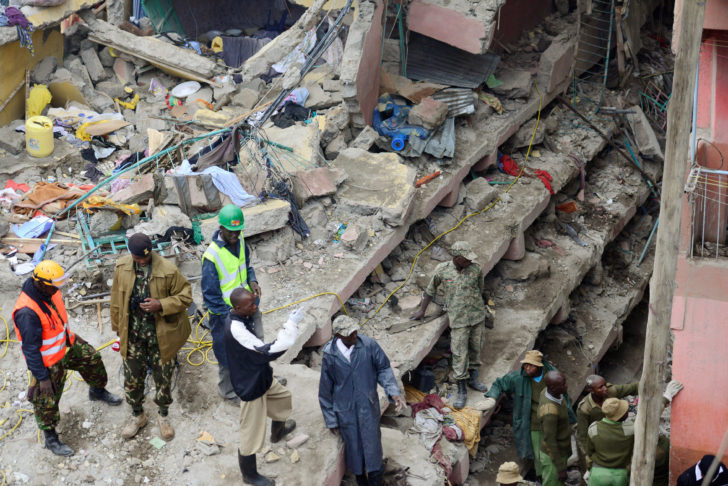 Rescue workers search for residents feared trapped in the rubble of a six-storey building that collapsed after days of heavy rain, in Nairobi