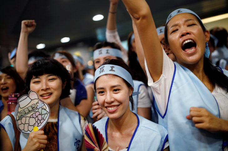 China Airlines flight attendants hold a rally announcing to strike against what they say is excessive working hours in their new labour rules, outside China Airlines' office in Taipei