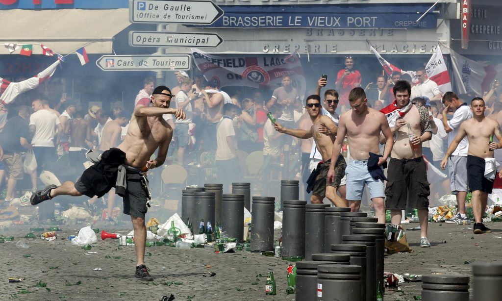 Football Soccer - Euro 2016 - England v Russia - Group B - Stade Velodrome, Marseille, France - 11/6/16 England supporters throw projectiles at the port of Marseille before the game. REUTERS/Jean-Paul Pelissier