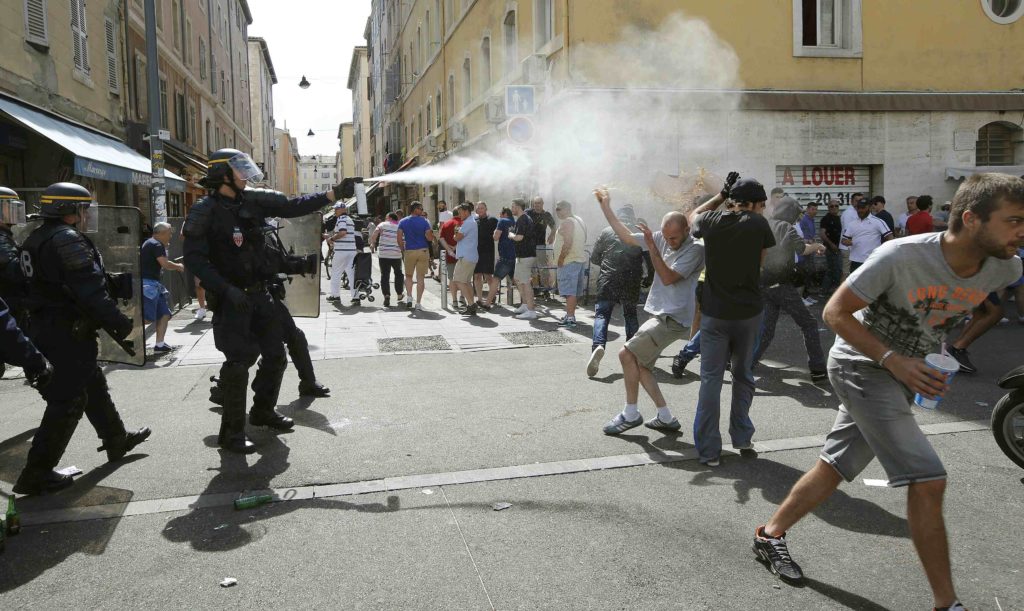 Football Soccer - Euro 2016 - England v Russia - Group B - Stade Velodrome, Marseille, France - 11/6/16 Police use teargas on supporters near port of Marseille before the game. REUTERS/Jean-Paul Pelissier