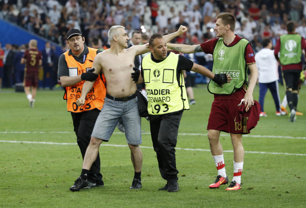 Football Soccer - England v Russia - EURO 2016 - Group B - Stade Vélodrome, Marseille, France - 11/6/16 A fan is restrained by security after the game REUTERS/Yves Herman Livepic