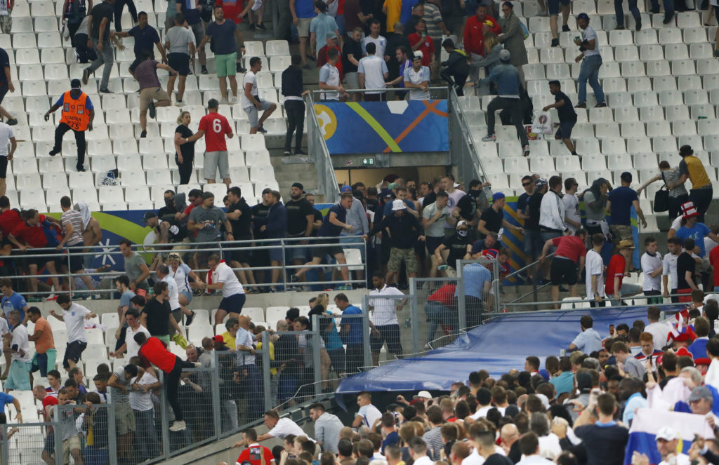 Football Soccer - England v Russia - EURO 2016 - Group B - Stade Vélodrome, Marseille, France - 11/6/16 England fans try to escape trouble in the stadium as clashes breakout REUTERS/Eddie Keogh Livepic