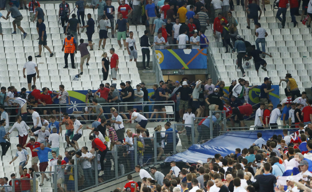 Football Soccer - England v Russia - EURO 2016 - Group B - Stade Vélodrome, Marseille, France - 11/6/16 England fans try to escape trouble in the stadium as clashes breakout REUTERS/Eddie Keogh Livepic