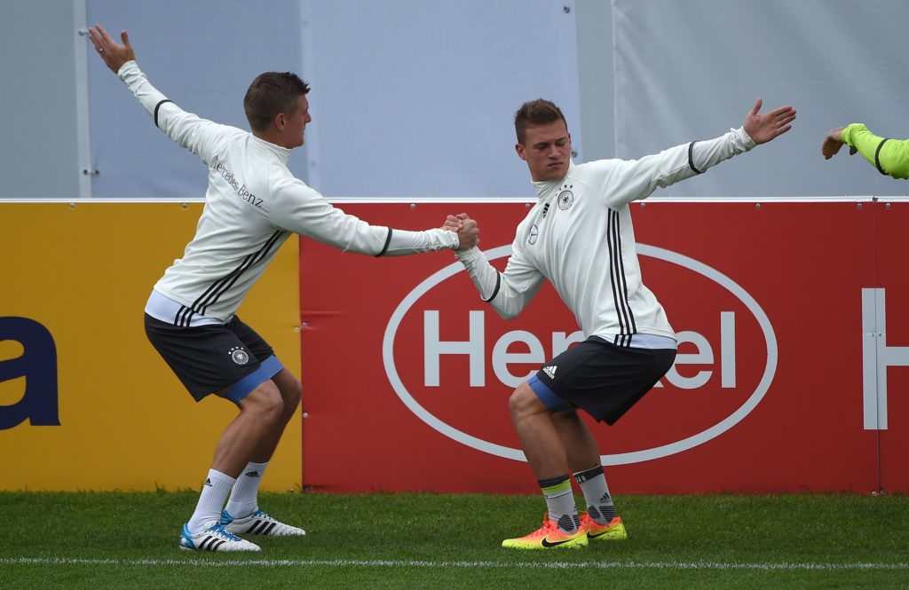 Germany's defender Joshua Kimmich (R) and Germany's midfielder Toni Kroos warm up during a training session as part of the team's preparation for the upcoming Euro 2016 European football championships, on June 2, 2016 in Ascona. / AFP PHOTO / PATRIK STOLLARZ