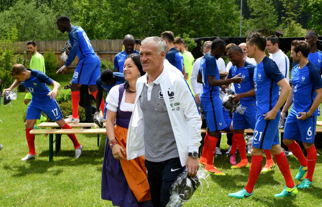 France's head coach Didier Deschamps (C) walks after a family photo at the hotel in Neustift im Stubaital, on June 2, 2016, as part of the team's preparation for the upcoming Euro 2016 European football championships. / AFP PHOTO / FRANCK FIFE