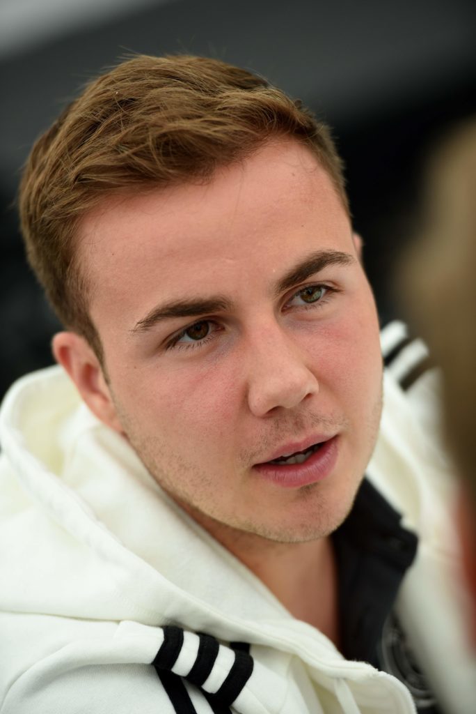 Germany's striker Mario Goetze gives interviews during a press meeting after a training session as part of the team's preparation for the upcoming Euro 2016 European football championship, in Ascona on June 2, 2016. / AFP PHOTO / PATRIK STOLLARZ