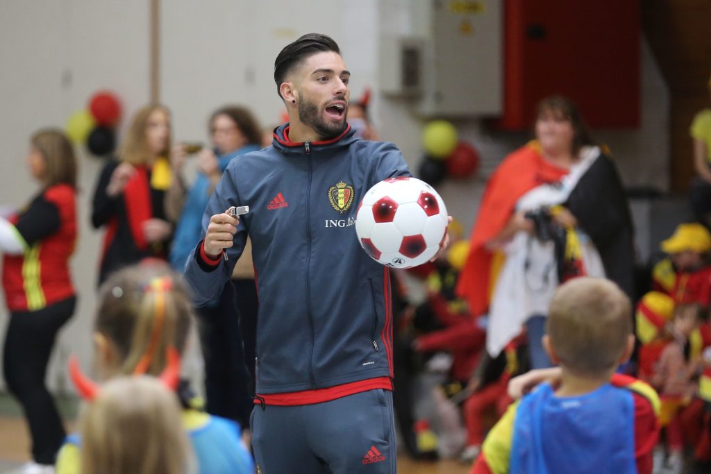 Belgium's forward Yannick Ferreira Carrasco is pictured during a visit of the Belgian national football team to the primary school "Ecole communale Les Rives du Hain" in Braine-le-Chateau, south of Brussels, on June 3, 2016. Belgium is preparing for the upcoming UEFA Euro 2016 football championships, taking place through June 10 - July 10, 2016 in France. / AFP PHOTO / Belga / BRUNO FAHY / Belgium OUT