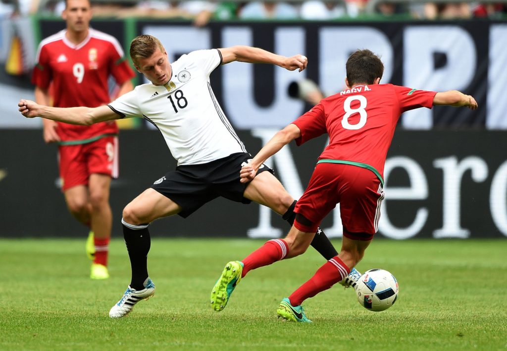 Germany's midfielder Toni Kroos (L) and Hungary´s Adam Nagy vie during the UEFA EURO 2016 friendly football match Germany vs Hungary in Gelsenkirchen, western Germany on June 4, 2016. / AFP PHOTO / PATRIK STOLLARZ