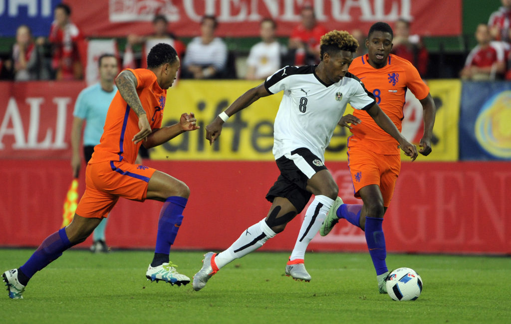Austria's David Alaba (C) vies with Kenny Tete (L) and Riechedly Bazoer of the Netherlands during the EURO 2016 friendly football match Austria vs Netherlands at Ernst Happel stadium in Vienna, Austria, on June 4, 2016.   / AFP PHOTO / HANS PUNZ