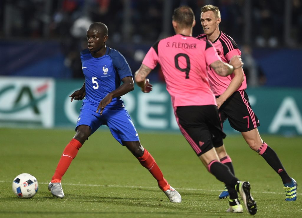 France's midfielder N'Golo Kante (L) fights for the ball with Scotland's forward Steven Fletcher (C) and Scotland's midfielder Darren Fletcher (R) during the friendly football match between France and Scotland, at the St Symphorien Stadium in Longeville-lès-Metz, Eastern France, on June 4, 2016.  / AFP PHOTO / JEAN-CHRISTOPHE VERHAEGEN
