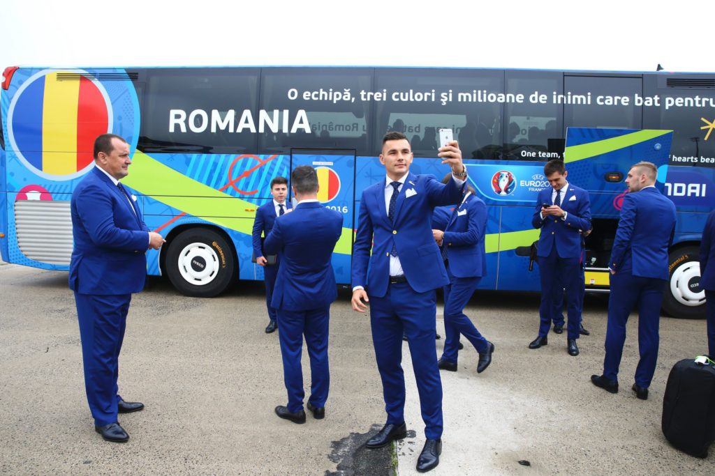 Handout photo provided by UEFA shows Ovidiu Hoban of Romania taking a selfie as he arrives with teamamtes at the Roissy-Charles de Gaulle airport on June 6, 2016 ahead of the Euro 2016 football tournament. / AFP PHOTO / Gwendoline Le Goff / RESTRICTED TO EDITORIAL USE - MANDATORY CREDIT "AFP PHOTO / SOURCE / BYLINE" - NO MARKETING - NO ADVERTISING CAMPAIGNS - DISTRIBUTED AS A SERVICE TO CLIENTS -