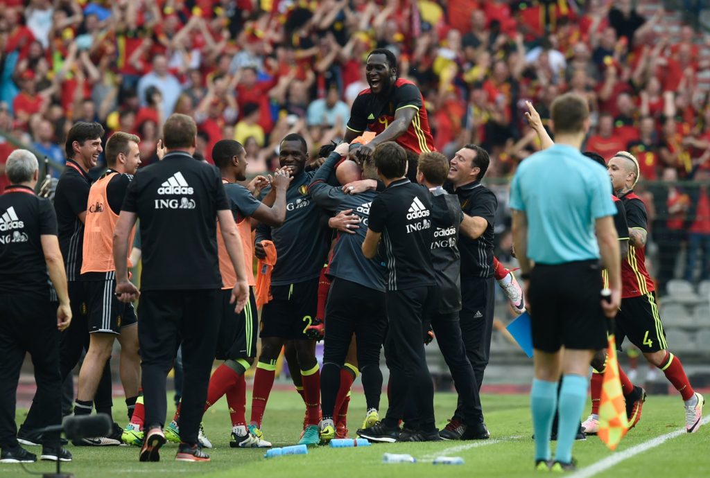 Belgium's midfielder Laurent Cimant (C, bottom) celebrates with teammates after scoring during the friendly football match between Belgium and Norway, at the King Baudouin Stadium, on June 5, 2016 in Brussels. / AFP PHOTO / JOHN THYS