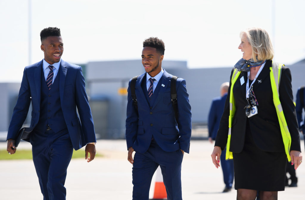 In this handout picture released by the Football Association (FA) England's (L-R) Daniel Sturridge and Raheem Sterling head to board the plane as the team departs for France for the UEFA Euro 2016 European football championships at Luton Airport in Luton, north of London, on June 6, 2016. England's opening match at the European Championship is against Russia on June 11. / AFP PHOTO / FOOTBALL ASSOCIATION (FA) / Michael Regan / RESTRICTED TO EDITORIAL USE - MANDATORY CREDIT " AFP PHOTO / FA / MICHAEL REGAN " - NO MARKETING NO ADVERTISING CAMPAIGNS - DISTRIBUTED AS A SERVICE TO CLIENTS