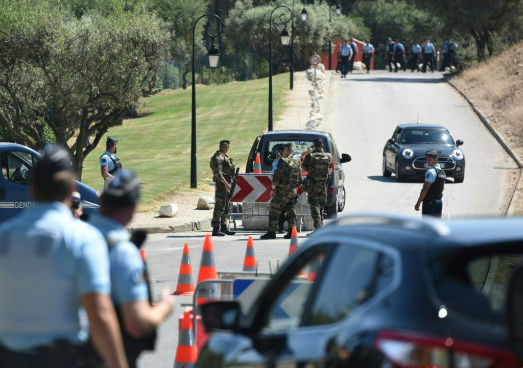 French police and French Foreign Legion soldiers secure a street ahead of the arrival of the Turkish national football team at the hotel ahead of the Euro 2016 football tournament in Bandol, southeastern France, on June 6, 2016.  / AFP PHOTO / BULENT KILIC