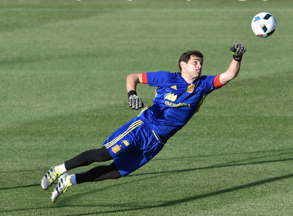 Spain's goalkeeper Iker Casillas jumps for the ball during a training session at Ciudad del Futbol (Soccer City) in Las Rozas, near Madrid on June 6, 2016. / AFP PHOTO / GERARD JULIEN