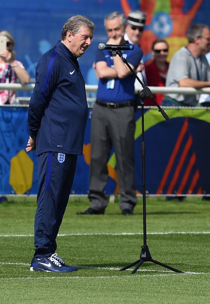 England's coach Roy Hodgson speaks in French to local people watching a training session at their training ground in Chantilly, on June 7, 2016 during the Euro 2016 football tournament.  / AFP PHOTO / PAUL ELLIS