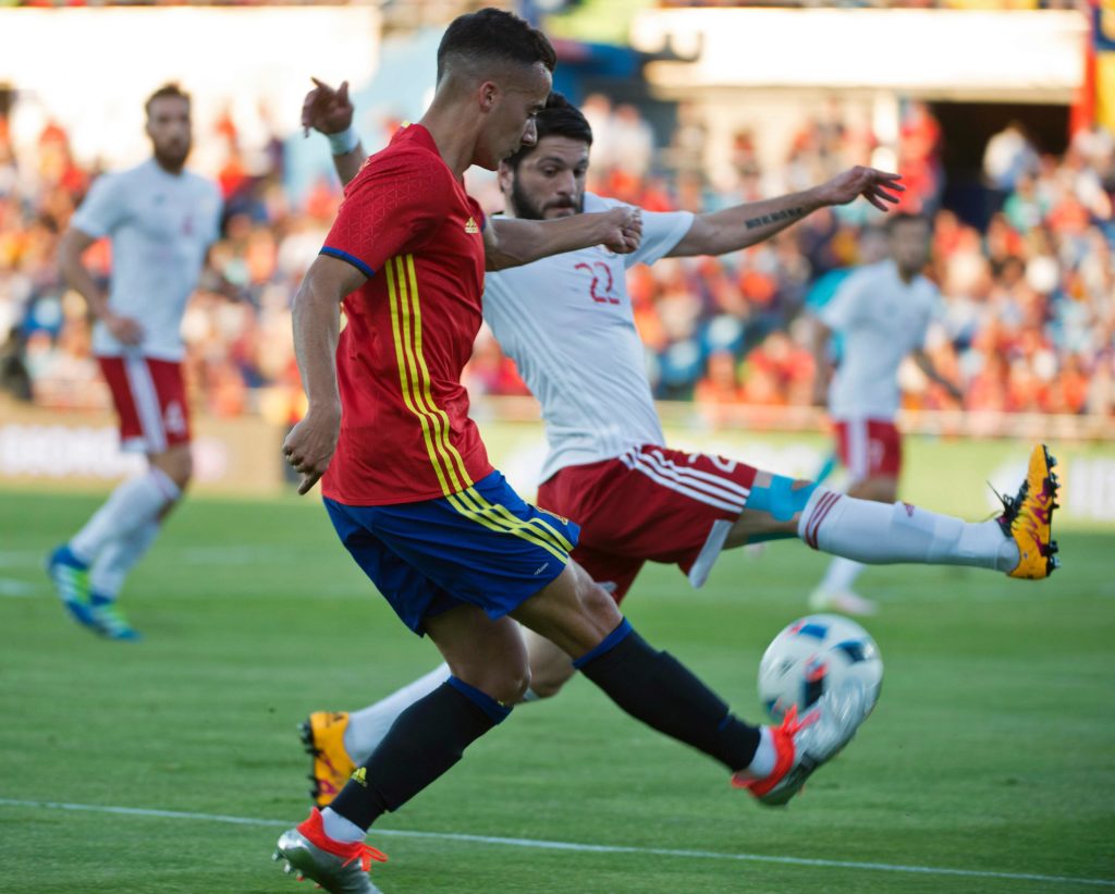 Spain's midfielder Lucas Vazquez (L) vies with Georgia's defender Giorgi Navalovski during the EURO 2016 friendly football match Spain vs Georgia at the Coliseum Alfonso Perez stadium in Getafe, on June 7, 2016, in preparation for the upcoming Euro 2016 European football championship. / AFP PHOTO / CURTO DE LA TORRE