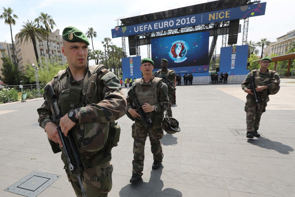 French soldiers patrol in the fan zone in Nice, southeastern France on June 8, 2016, two days before the start of the Euro 2016 football championship, to be held in France from June 10 till July 10, 2016.  Organisers of Europe's four-yearly football extravaganza already face security jitters and Britain joined the United States in warning the tournament could be a target for terror attacks. / AFP PHOTO / VALERY HACHE