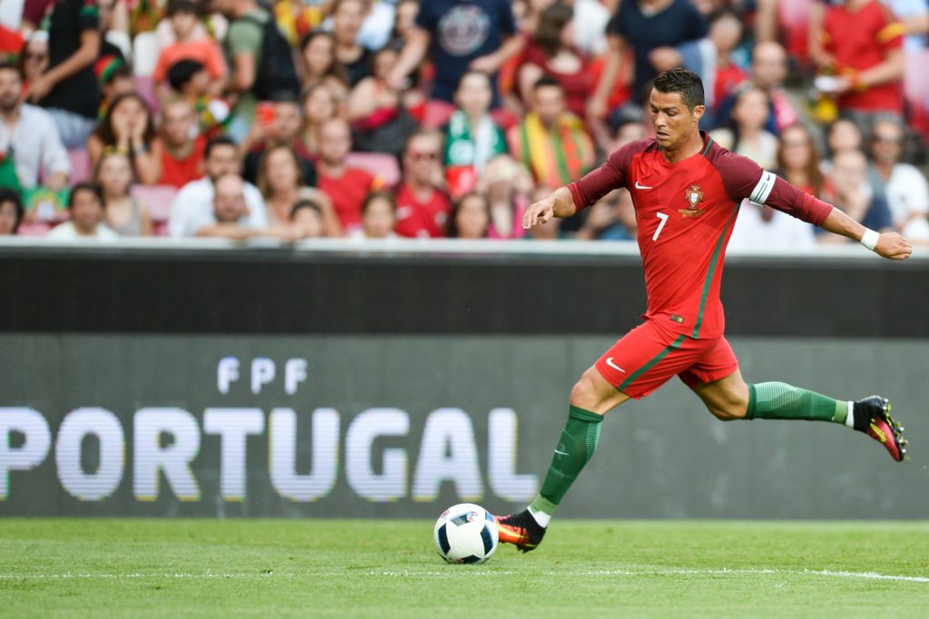 Portugal's forward Cristiano Ronaldo controls the ball during the friendly football match Portugal vs Estonia at Luz stadium in Lisbon on June 8, 2016, in preparation for the upcoming UEFA Euro 2016 Championship. / AFP PHOTO / PATRICIA DE MELO MOREIRA