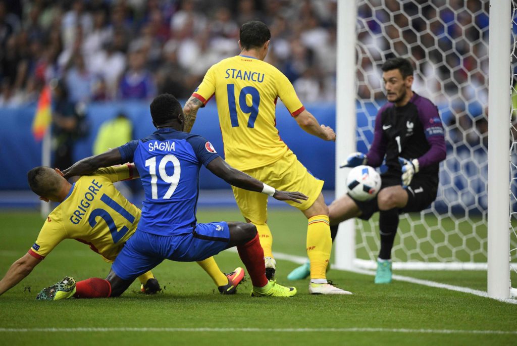 France's goalkeeper Hugo Lloris blocks the ball during the Euro 2016 group A football match between France and Romania at Stade de France, in Saint-Denis, north of Paris, on June 10, 2016. / AFP PHOTO / MARTIN BUREAU