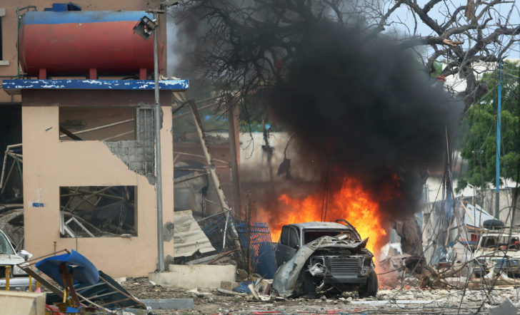 A vehicle burns at the scene of a suicide bomb attack outside Nasahablood hotel in Somalia's capital Mogadishu