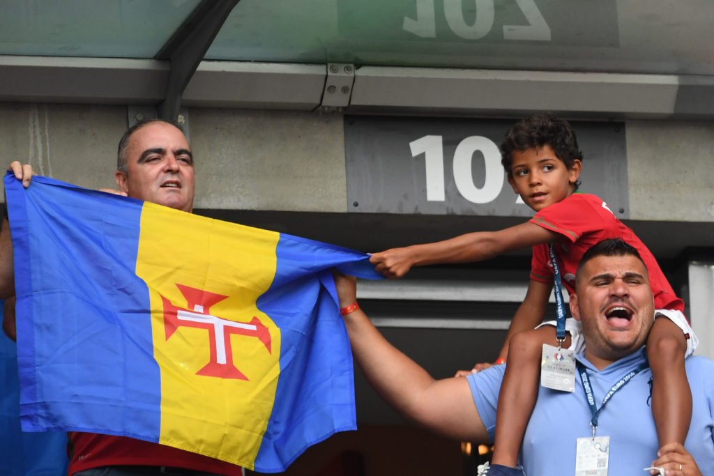 Portugal's forward Cristiano Ronaldo's son Cristiano junior (R) cheers ahead of the Euro 2016 final football match between Portugal and France at the Stade de France in Saint-Denis, north of Paris, on July 10, 2016. / AFP PHOTO / FRANCISCO LEONG