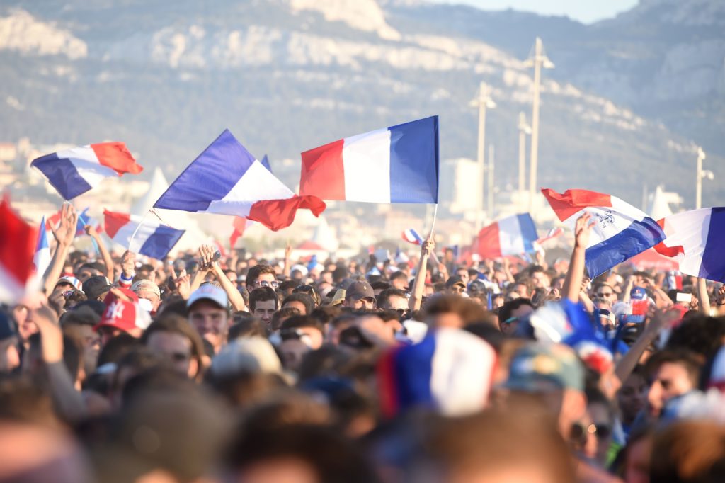 France supporters cheer prior to the Euro 2016 final football match between Portugal and France at the Marseille Fan Zone, on July 10, 2016. / AFP PHOTO / BORIS HORVAT