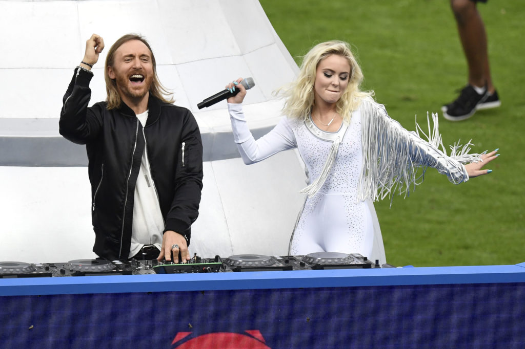 French DJ David Guetta (L) and Swedish singer Zara Larsson perform during the closing ceremony ahead the Euro 2016 final football match between Portugal and France at the Stade de France in Saint-Denis, north of Paris, on July 10, 2016. / AFP PHOTO / MIGUEL MEDINA