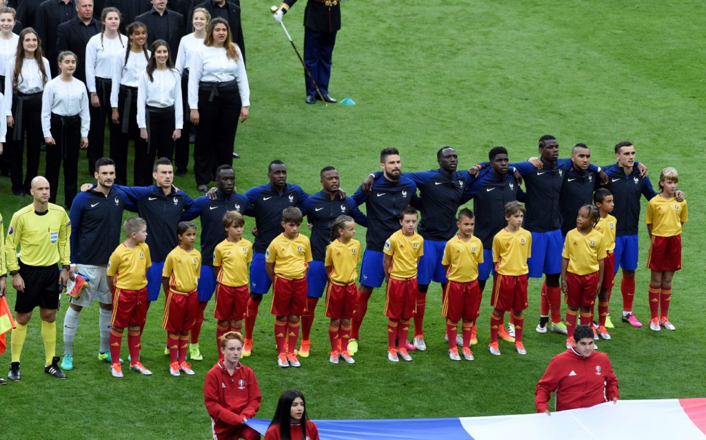 France's players sing the national anthem during the closing ceremony ahead the Euro 2016 final football match between Portugal and France at the Stade de France in Saint-Denis, north of Paris, on July 10, 2016. / AFP PHOTO / MIGUEL MEDINA