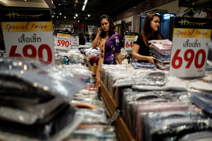 People shop at a department store in Bangkok