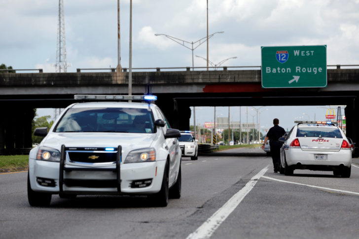 Police officers block off a road after a shooting of police in Baton Rouge
