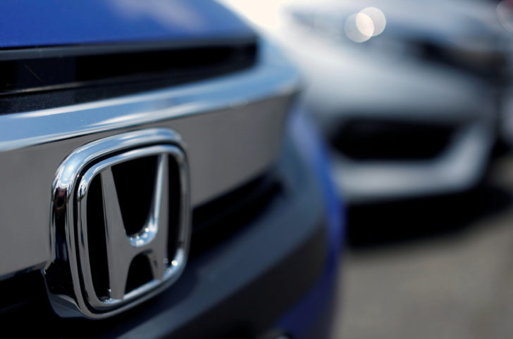 The Honda logo is seen on a new Civic model on a dealer's lot in Silver Spring