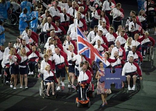 Great Britain's Paralympic team is led by flagbearer Lee Pearson GBR, representing Great Britain in Equestrian, as they enter Maracana Stadium during the Opening Ceremony of the Rio 2016 Paralympic Games at the Maracana Stadium in Rio de Janeiro, Brazil, on September 7, 2016. Photo by Simon Bruty/OIS/IOC via AFP. RESTRICTED TO EDITORIAL USE. / AFP PHOTO / OIS/IOC / Simon Bruty for OIS/IOC