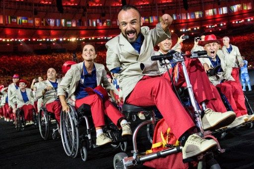 Members of Spain's delegation enter during the opening ceremony of the Rio 2016 Paralympic Games at the Maracana stadium in Rio de Janeiro on September 7, 2016. / AFP PHOTO / YASUYOSHI CHIBA