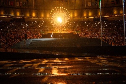 The Paralympic cauldron is lit by Brazilian swimmer Clodoaldo Silva during the opening ceremony of the Rio 2016 Paralympic Games at the Maracana stadium in Rio de Janeiro on September 7, 2016. / AFP PHOTO / YASUYOSHI CHIBA