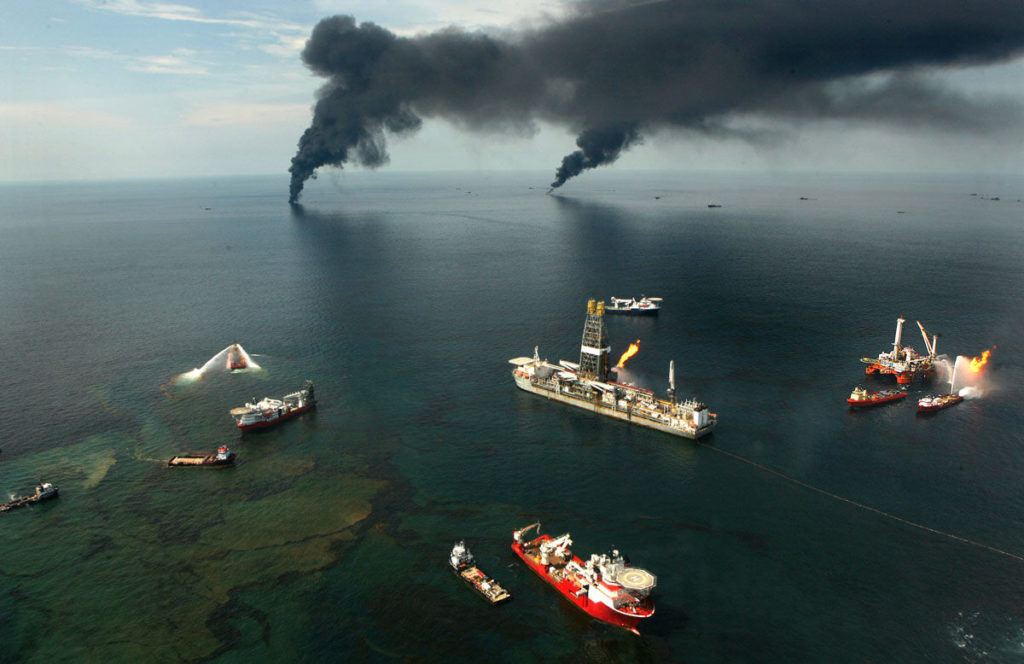FILE - Fires burn around the site of the BP Deepwater Horizon rig site in the Gulf of Mexico, June 19, 2010. Interior Secretary Ken Salazar's flight to the Development Driller II earlier this month was in many ways a dramatization of the challenges facing the Obama administration as it responds to the worst oil spill in U.S. history. (Carolyn Cole/Los Angeles Times) ORG XMIT: 1090437 ORG XMIT: CHI1006222223462079