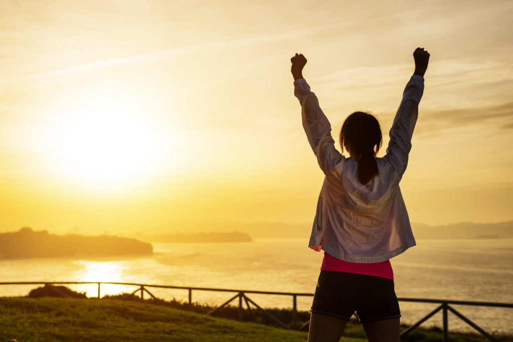 stock-woman-happy-sunset-success-joy-8m1q