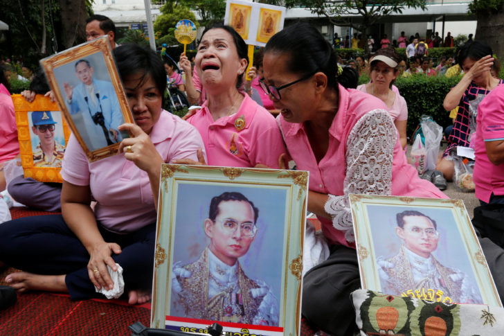 Well-wishers weep as they prays for Thailand's King Bhumibol Adulyadej at the Siriraj hospital where he is residing in Bangkok