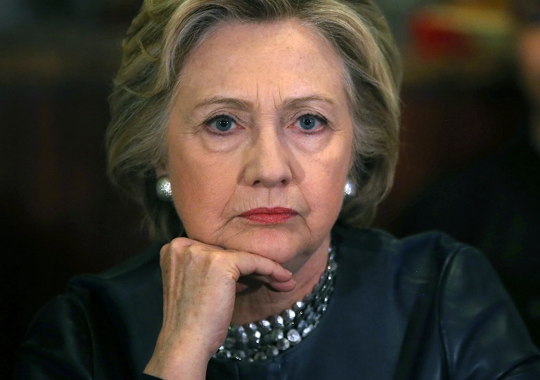 NEW HAVEN, CT - APRIL 23: Democratic presidential candidate former Secretary of State Hillary Clinton looks on during a roundtable discussion with community members at Orangeside on Temple on April 23, 2016 in New Haven, Connecticut. Hillary Clinton met with local residents to discuss her plans to raise the minimum wage and fight for equal pay for women and paid leave for working families as she campaigns in Connecticut ahead of Tuesday's presidential primary.   Justin Sullivan/Getty Images/AFP