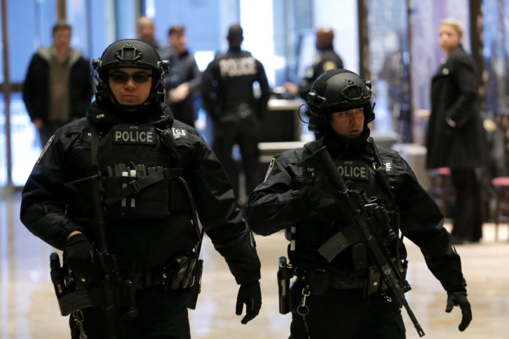 Heavily armed New York City Police officers patrol the main lobby at Trump Tower where U.S. President-elect Donald Trump lives in New York