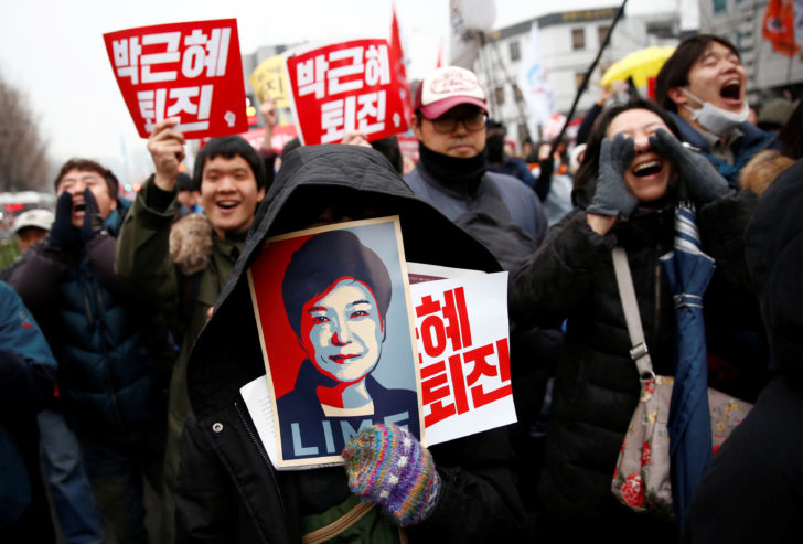 Protesters shout slogans calling South Korean President Park Geun-hye to step down in Seoul