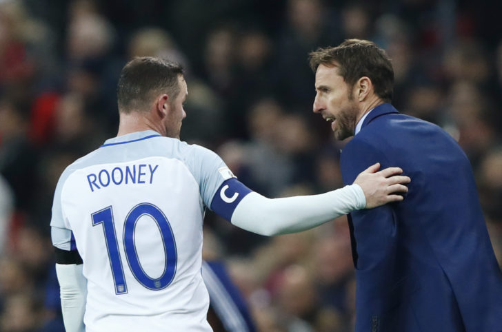 England interim manager Gareth Southgate speaks with Wayne Rooney