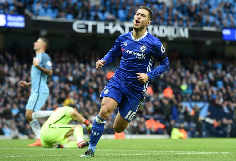Chelsea's Belgian midfielder Eden Hazard celebrates scoring his team's third goal during the English Premier League football match between Manchester City and Chelsea at the Etihad Stadium in Manchester, north west England, on December 3, 2016. / AFP PHOTO / Paul ELLIS / RESTRICTED TO EDITORIAL USE. No use with unauthorized audio, video, data, fixture lists, club/league logos or 'live' services. Online in-match use limited to 75 images, no video emulation. No use in betting, games or single club/league/player publications. /