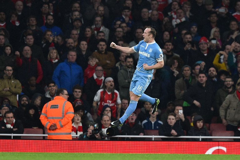 Stoke City's Scottish midfielder Charlie Adam celebrates after scoring their first goal during the English Premier League football match between Arsenal and Stoke City at the Emirates Stadium in London on December 10, 2016. / AFP PHOTO / Glyn KIRK / RESTRICTED TO EDITORIAL USE. No use with unauthorized audio, video, data, fixture lists, club/league logos or 'live' services. Online in-match use limited to 75 images, no video emulation. No use in betting, games or single club/league/player publications. /
