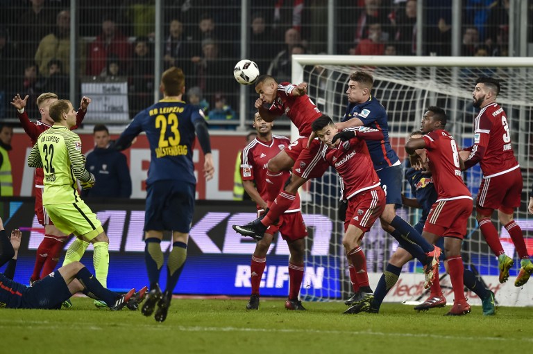 Ingolstadt's French defender Marcel Tisserand (C) heads a ball during the German first division Bundesliga football match between Ingolstadt and Leipzig in Ingolstadt, southern Germany, on December 10, 2016. / AFP PHOTO / GUENTER SCHIFFMANN / RESTRICTIONS: DURING MATCH TIME: DFL RULES TO LIMIT THE ONLINE USAGE TO 15 PICTURES PER MATCH AND FORBID IMAGE SEQUENCES TO SIMULATE VIDEO. == RESTRICTED TO EDITORIAL USE == FOR FURTHER QUERIES PLEASE CONTACT DFL DIRECTLY AT + 49 69 650050